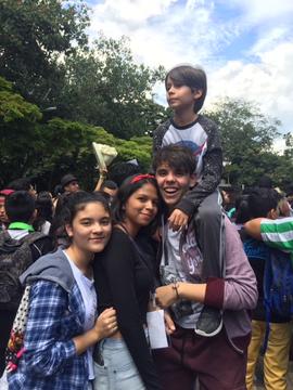 A subset of our students, including the youngest one of them, are seen celebrating at the end of the week.